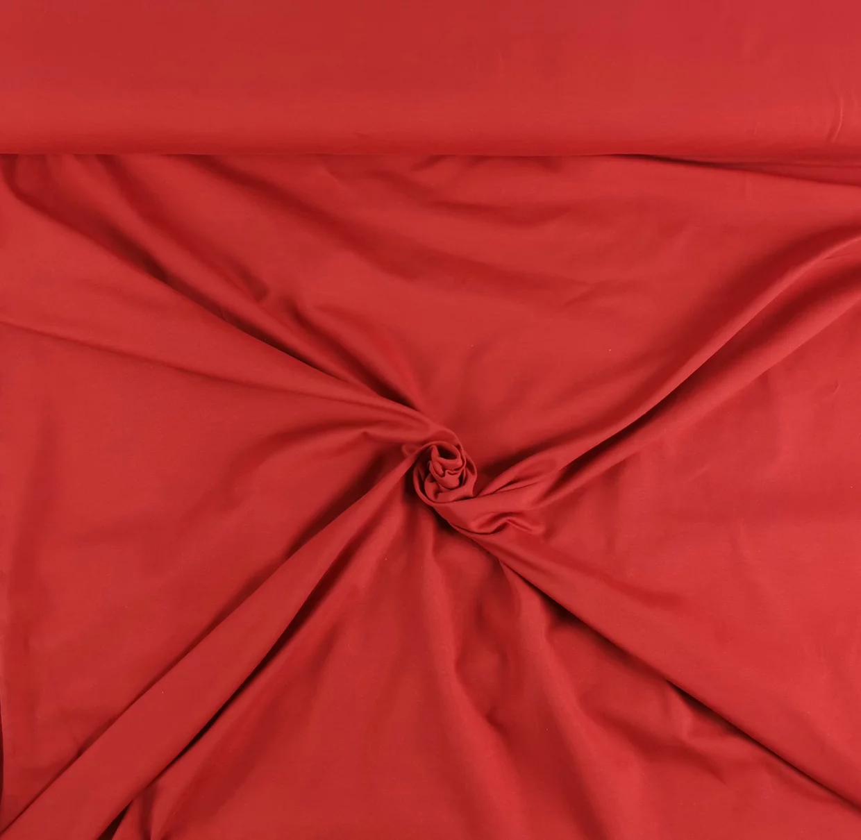 Kuvassa Yksivärinen puuvillatrikoo - vähän elastaania Tummanpunainen / joulunpunainen - X160